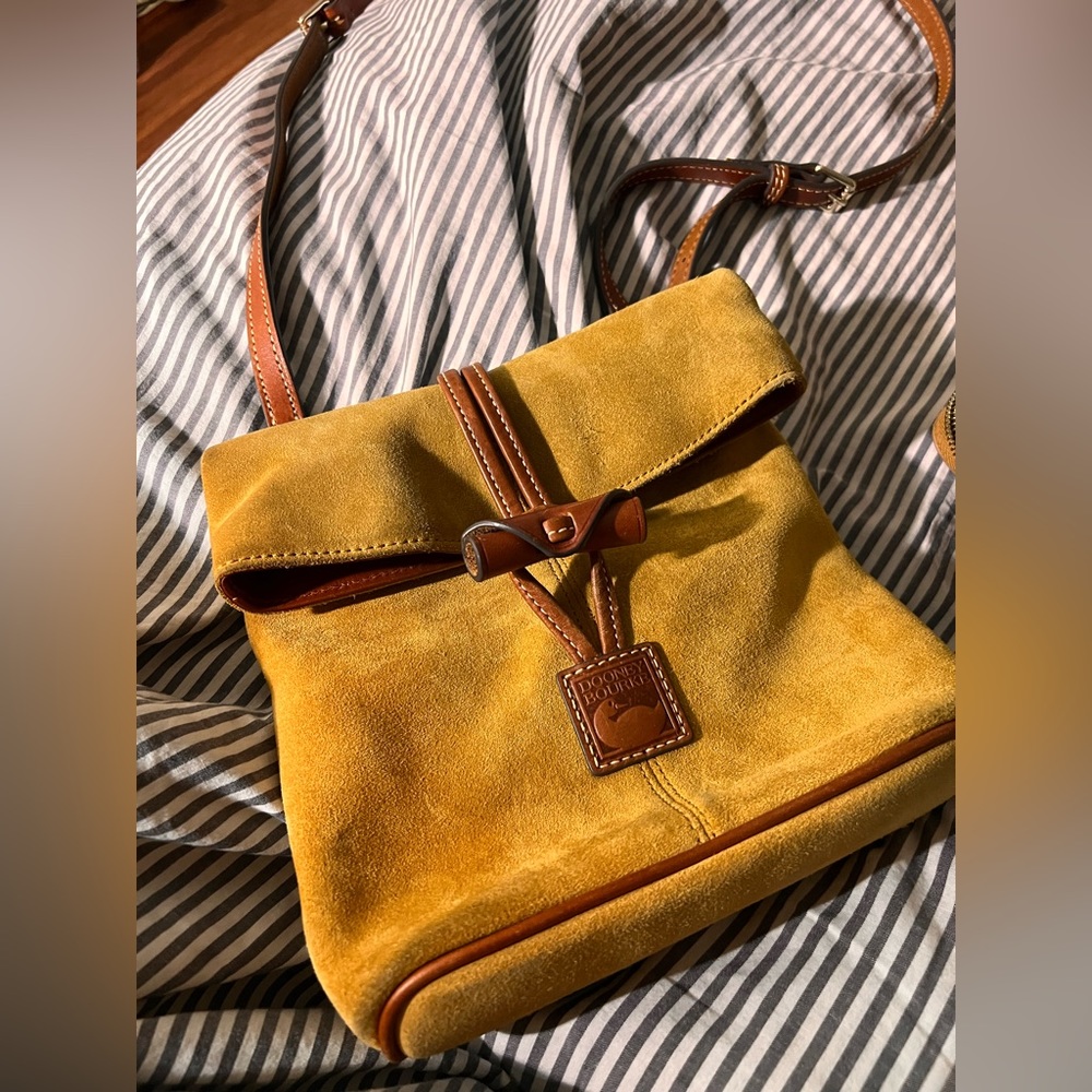 Dooney & Bourke satchel. only a small spot on the bottom from rubbing on jeans